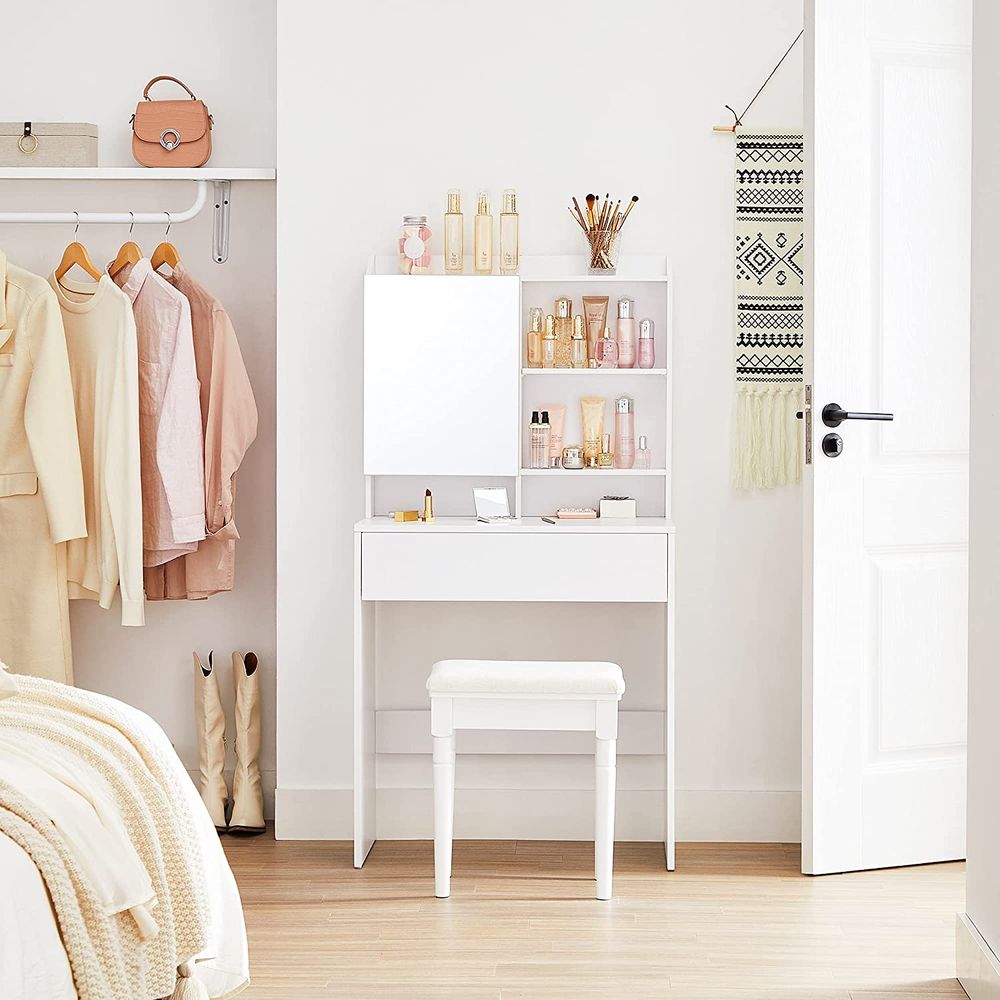 Minimalist white dressing table featuring a hidden storage shelf behind the mirror, an open compartment for perfumes, a spacious drawer, and a top shelf for personalized décor. Crafted from high-quality chipboard, it is both elegant and durable, perfect for modern spaces.