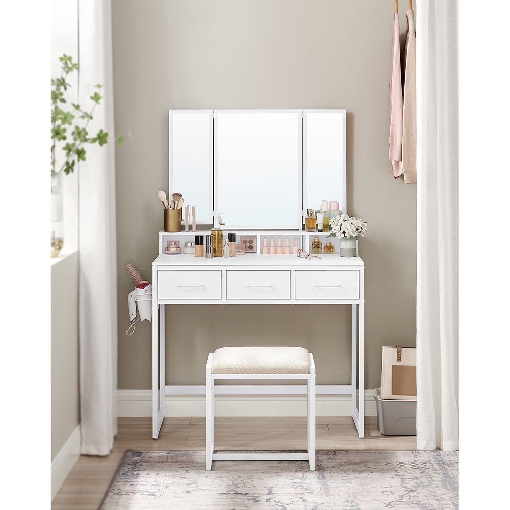 Elegant dressing table set with a tri-fold mirror, three spacious drawers, and a padded stool. Available in Brown, Oak Brown, Gray, and White, with a sturdy steel frame and ample storage options.