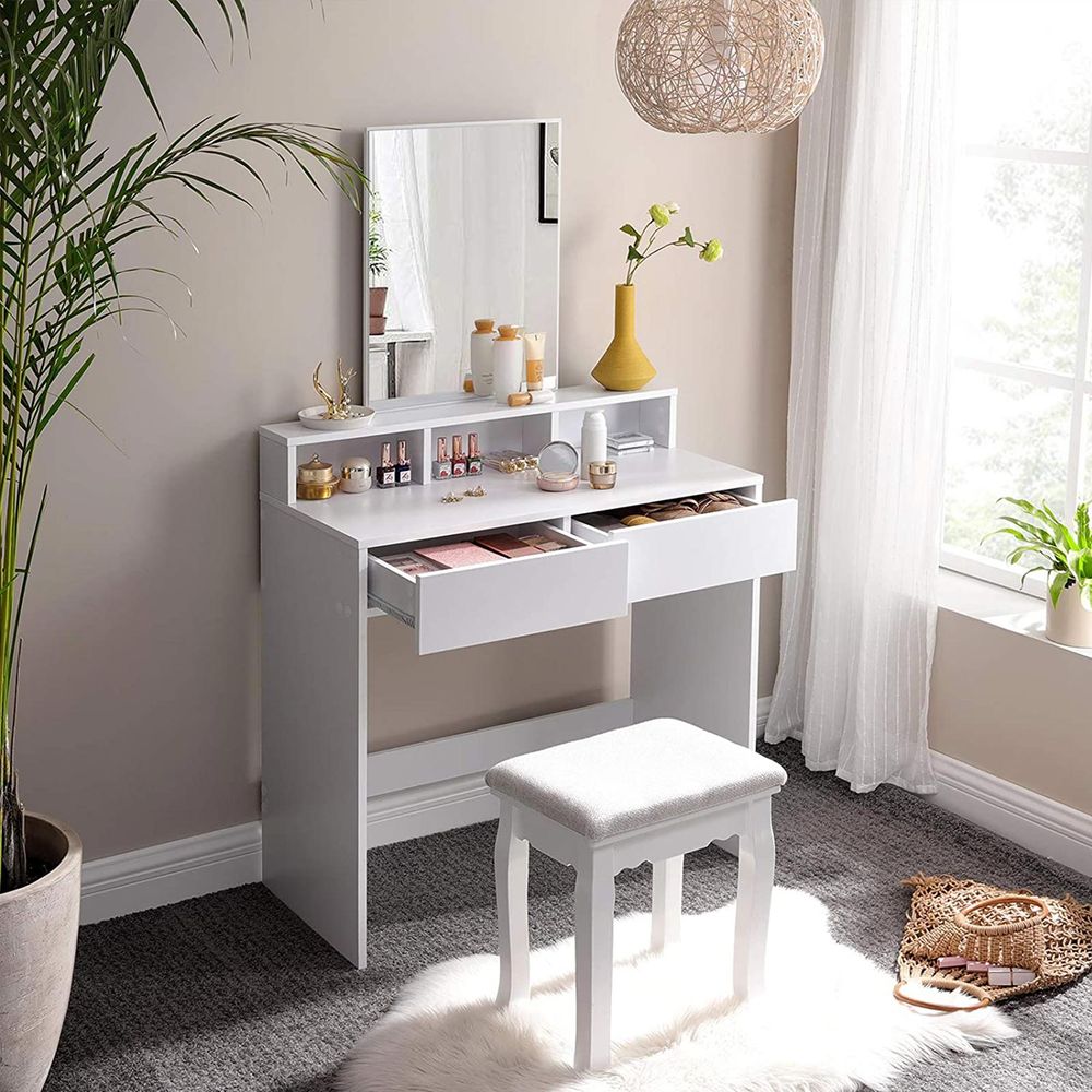 Elegant white dressing table with a rectangular mirror, 2 large drawers for makeup storage, 3 open compartments for nail polish and cosmetics, and a raised shelf for perfume bottles. The table features a modern design with melamine coating for easy cleaning and includes anti-tip protection for safety. Ideal for organizing your beauty essentials.