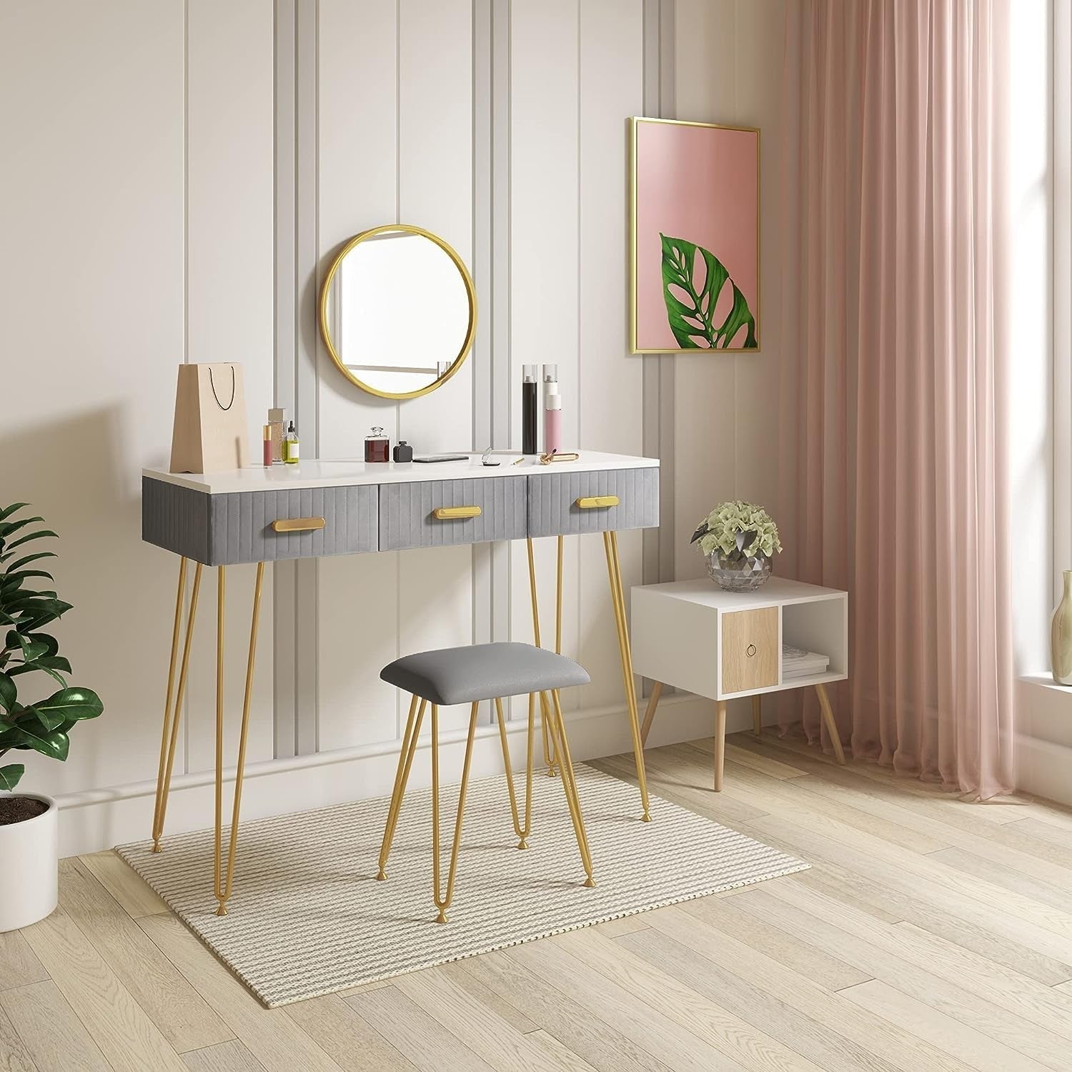 Elegant Velvet Charm Vanity Makeup Table with a large round mirror, soft velvet stool, and storage drawers in pink and gray, perfect for organizing beauty essentials.