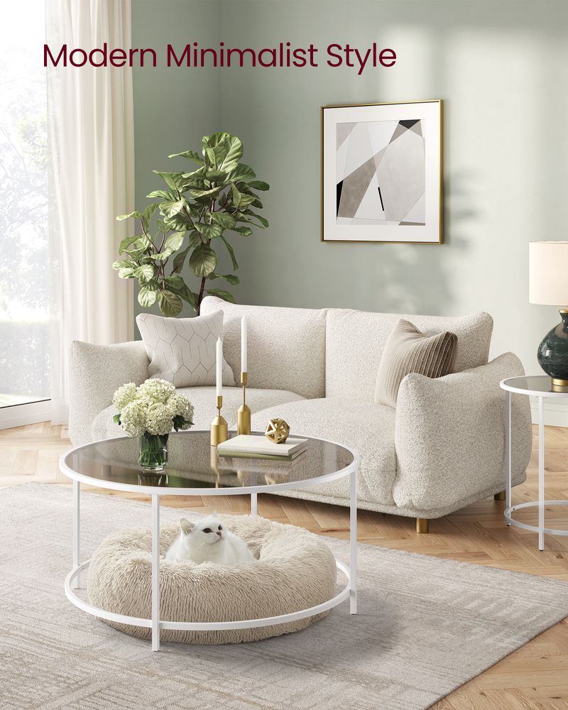 VASAGLE Modern Glass Coffee Table with a sleek pearl white frame, durable tempered glass top, and minimalist round design, offering stability, elegance, and functionality for any modern living room.







