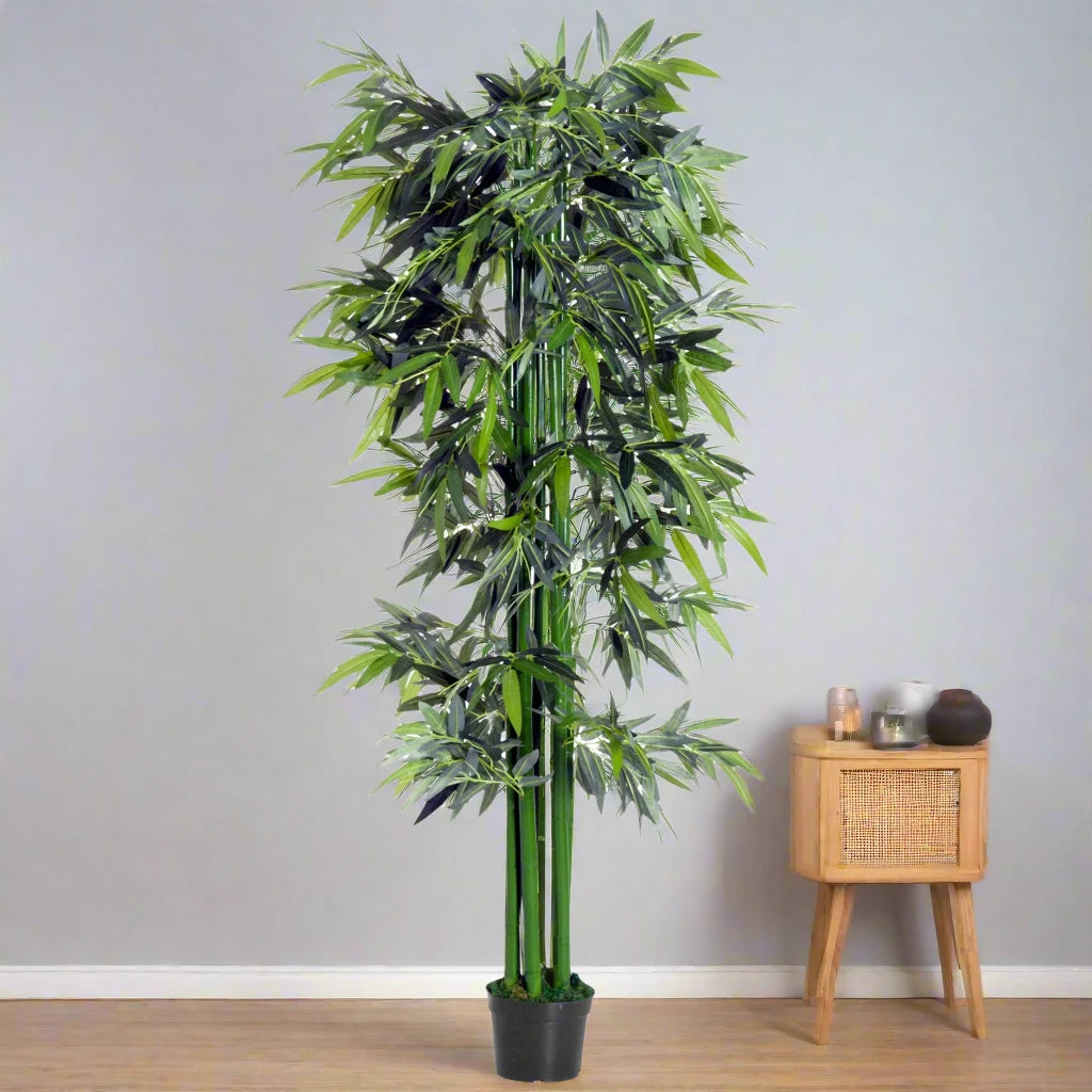 180 cm artificial bamboo tree with realistic green leaves and a sturdy black pot, perfect for home, office, or outdoor use. No watering or maintenance required.