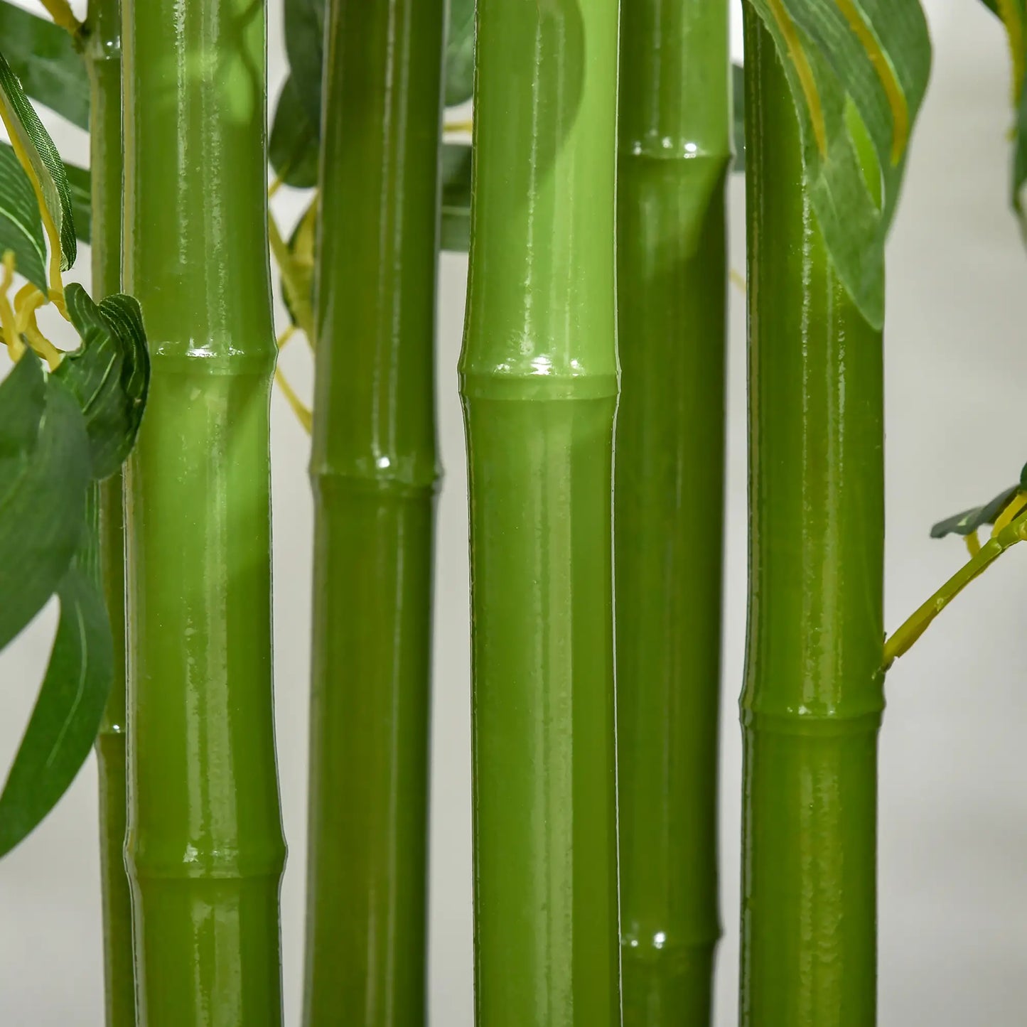 180 cm artificial bamboo tree with realistic green leaves and a sturdy black pot, perfect for home, office, or outdoor use. No watering or maintenance required.