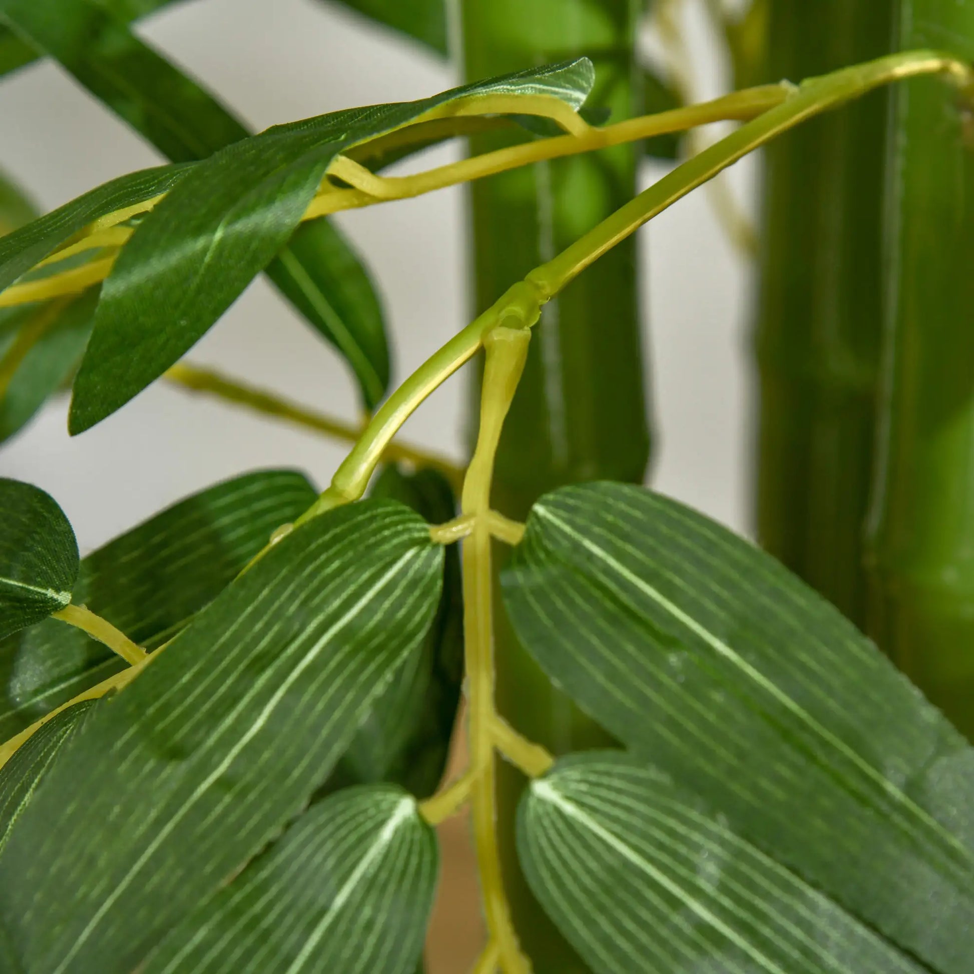 180 cm artificial bamboo tree with realistic green leaves and a sturdy black pot, perfect for home, office, or outdoor use. No watering or maintenance required.