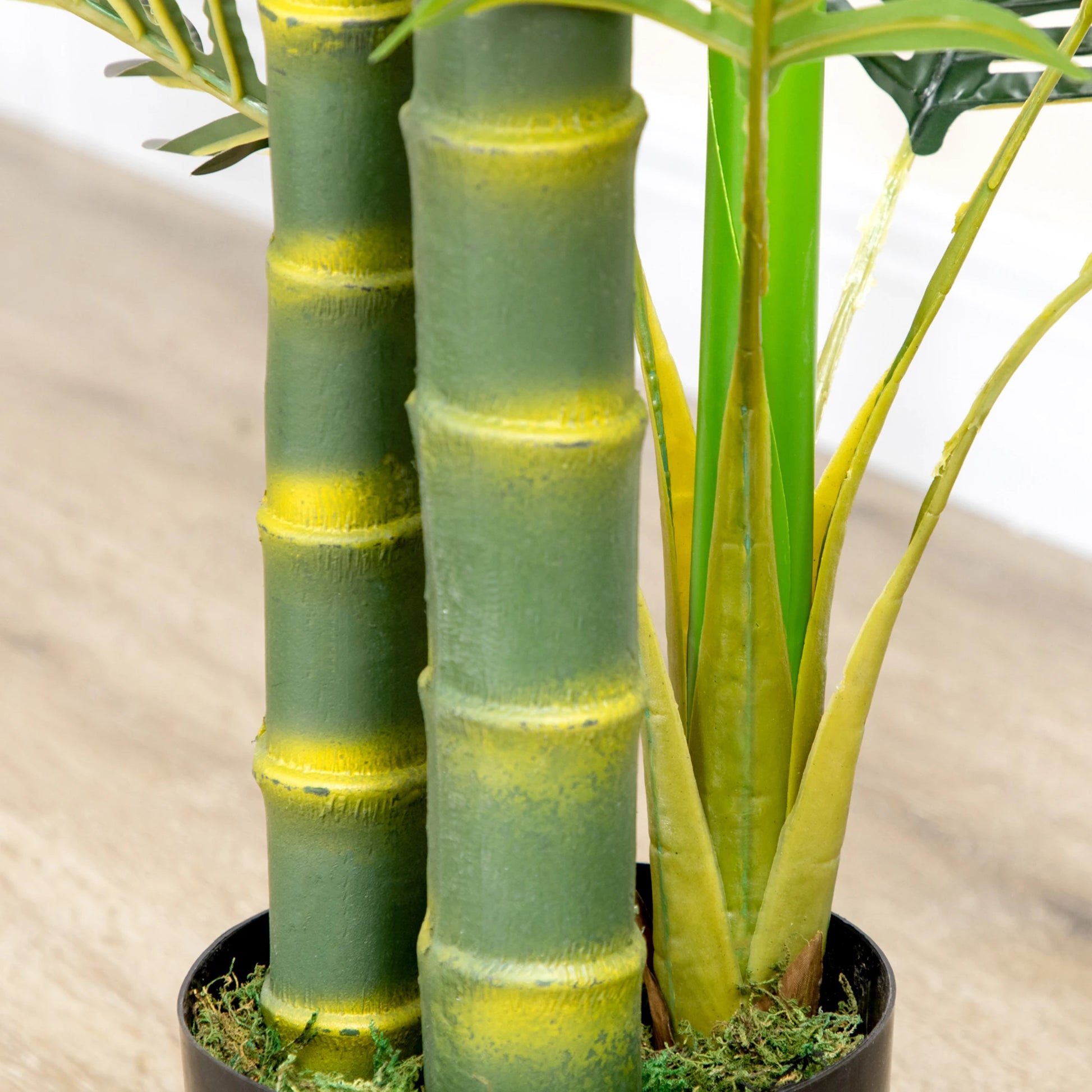 150 cm artificial Areca palm tree with 21 lifelike green leaves, set in a black planter with cement filling. Perfect for indoor or outdoor décor, maintenance-free.

