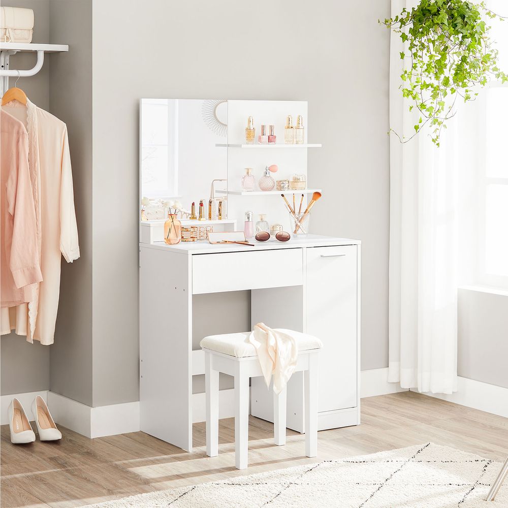 Elegant white dressing table with a frameless mirror, shelves for lipsticks and creams, a drawer for eye shadows and brushes, and a cupboard for skincare products. The sleek design and smooth lacquer coating make it a timeless addition to any room.






