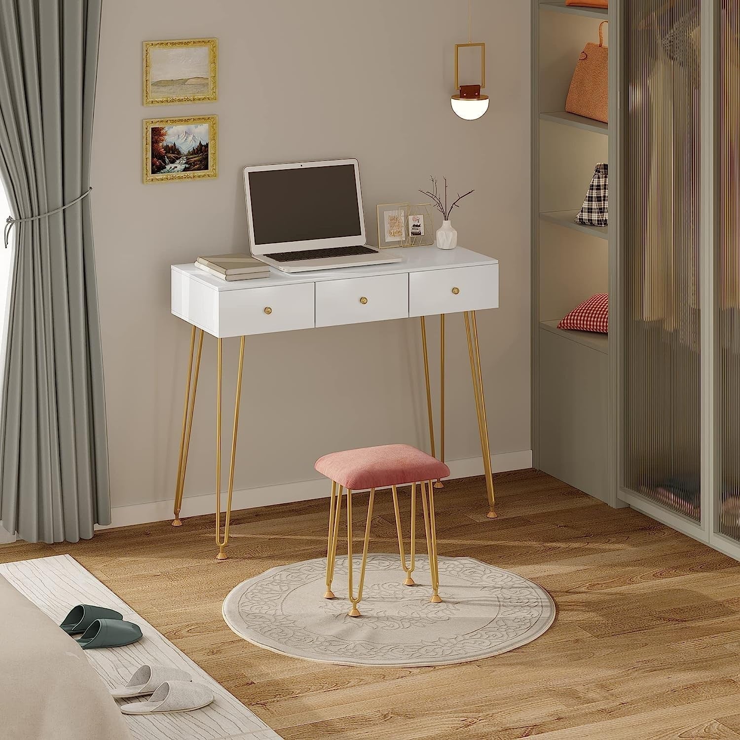 "Golden Elegance vanity makeup table with gold metal frame, spacious white drawers, velvet-padded stool, and a round wall-mounted mirror for modern interiors."

