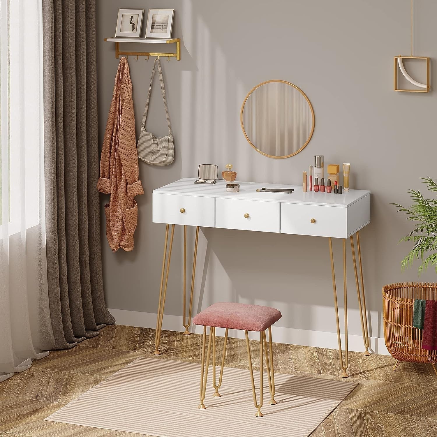 "Golden Elegance vanity makeup table with gold metal frame, spacious white drawers, velvet-padded stool, and a round wall-mounted mirror for modern interiors."

